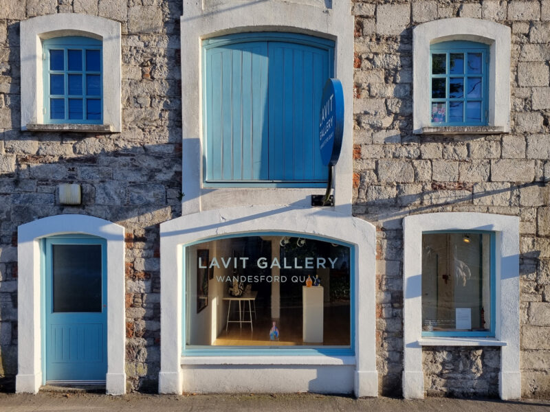 Lavit Gallery main entrance in Cork, featuring blue doors and windows, with a sign displaying the gallery name.