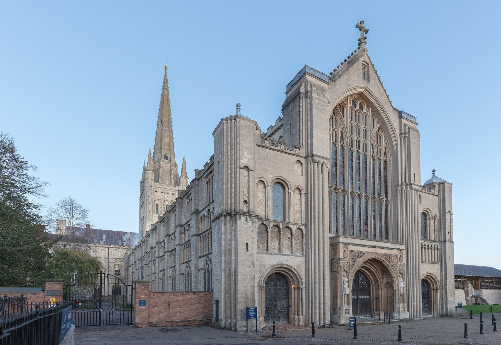 Gothic-style Norwich Cathedral in England, featuring a tall spire and intricate stonework, captured on November 19, 2022.