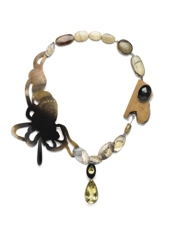 Necklace featuring a butterfly design, various stones, and a yellow drop pendant, showcasing Åsa Lockner's craftsmanship.