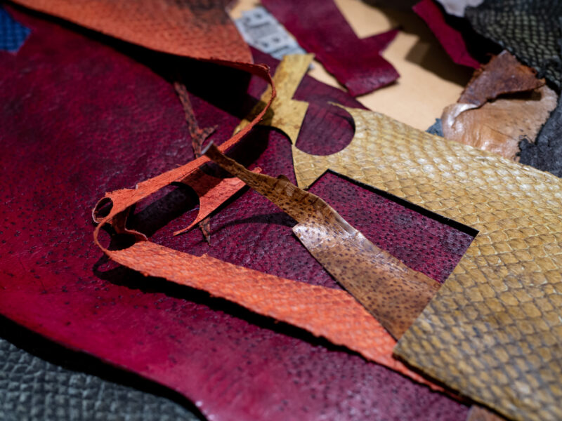 Colorful scraps of handmade goods, including various textured leather pieces, displayed at Wilgart.