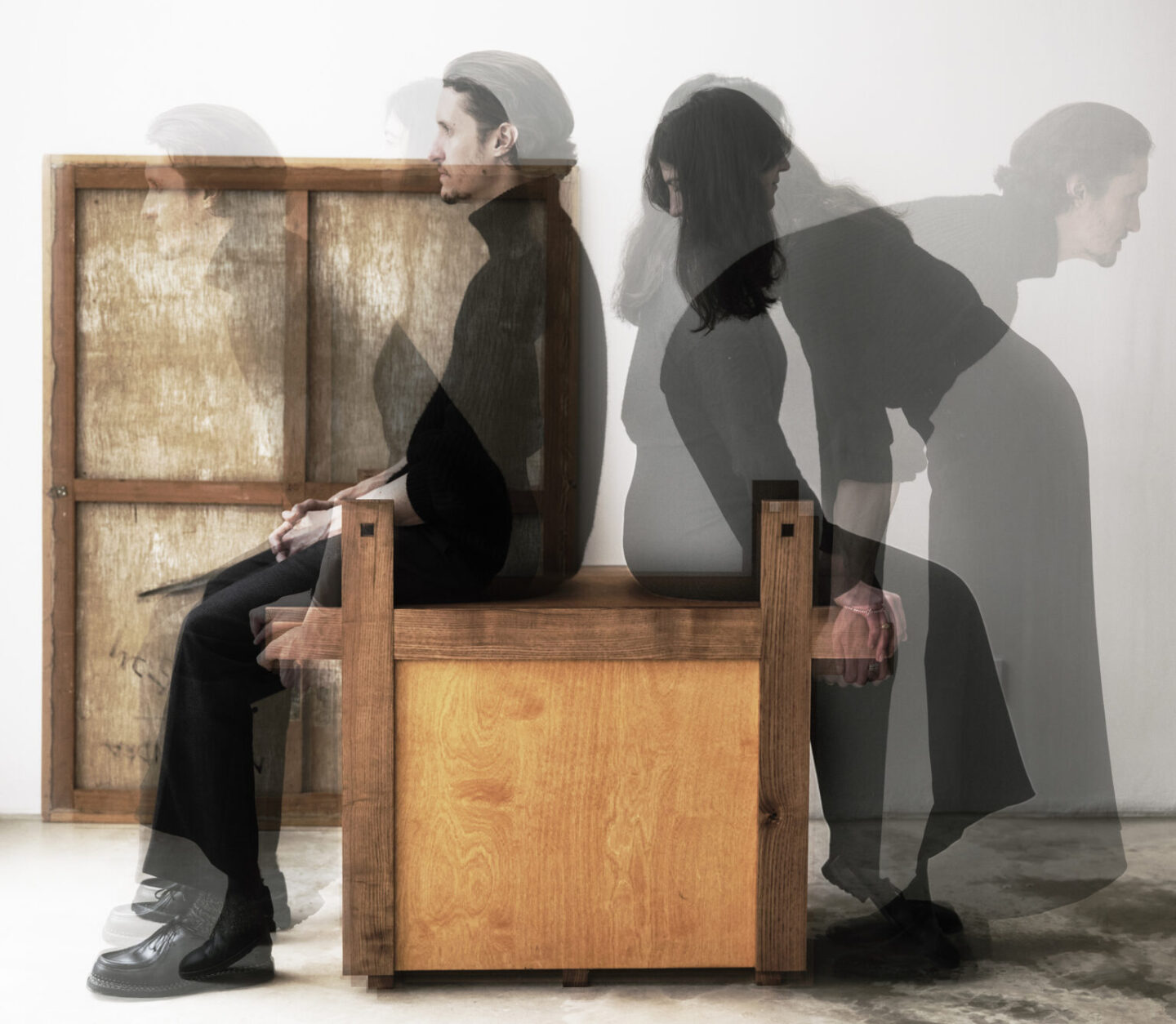 A wooden bench with two figures in motion, showcasing the blend of traditional and modern design in the Kasagi piece.