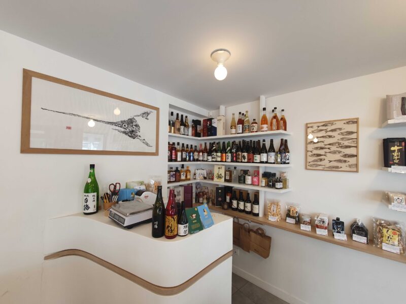 Interior of Umai shop in Paris, featuring shelves stocked with Japanese beverages and snacks.