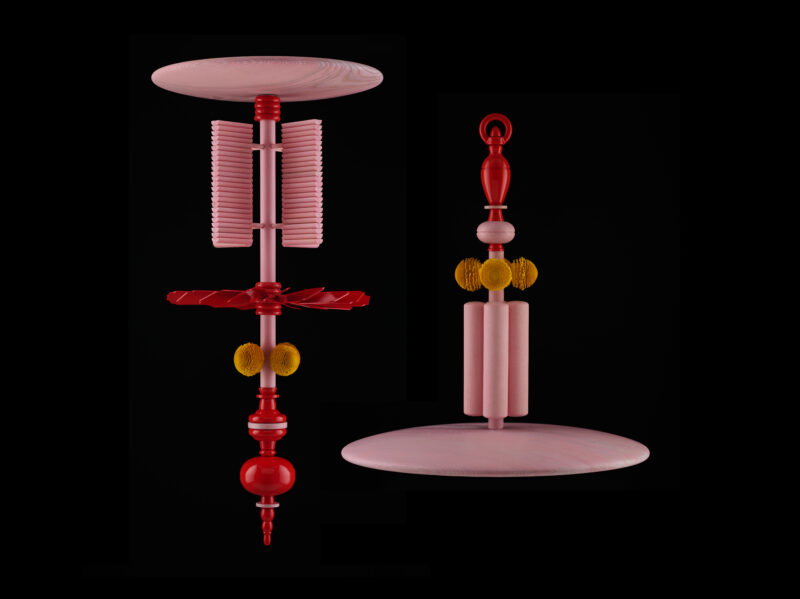 Colorful satellite chandelier design featuring pink, red, and yellow elements on a black background.