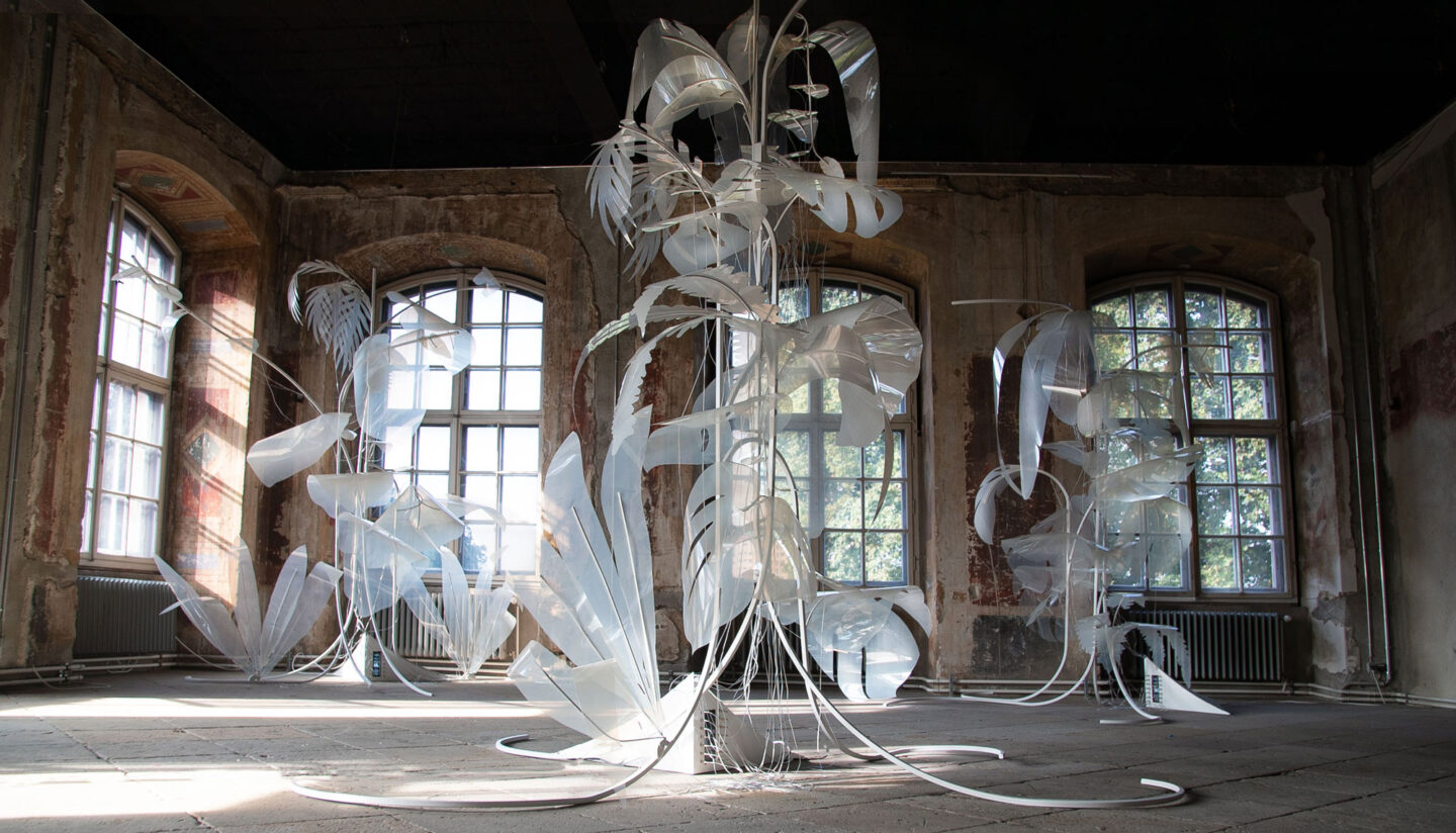 Abstract installation featuring translucent, flowing forms in a sunlit room with large windows, titled "Wither" by Thijs B...