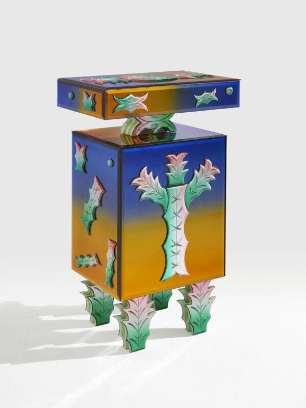 Colorful, artistic cabinet with a vibrant gradient and decorative leaf motifs, designed by Lucia Massari for Vetralia.