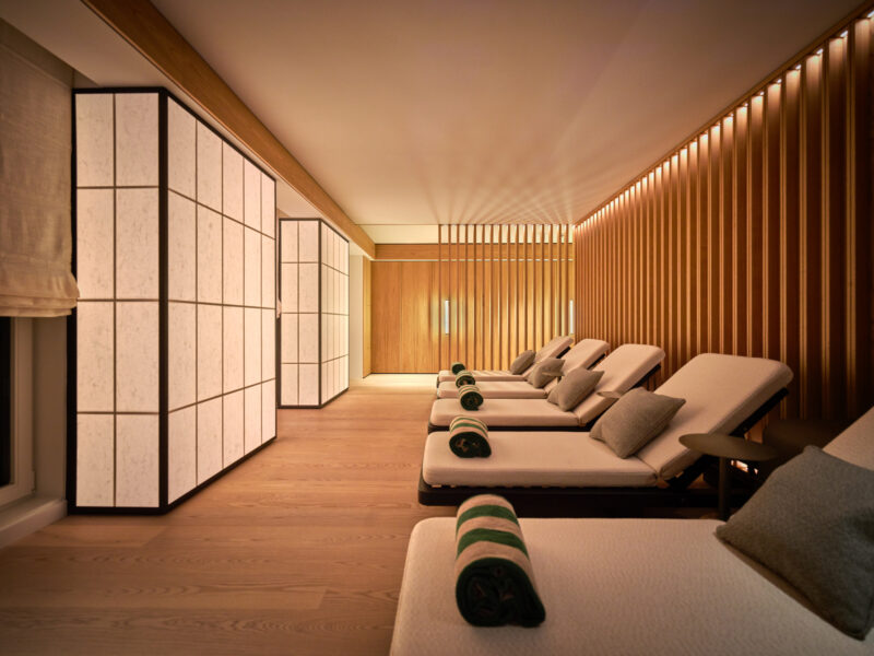 Spa area with lounge chairs, wooden walls, and soft lighting, creating a serene atmosphere at The Florentin.