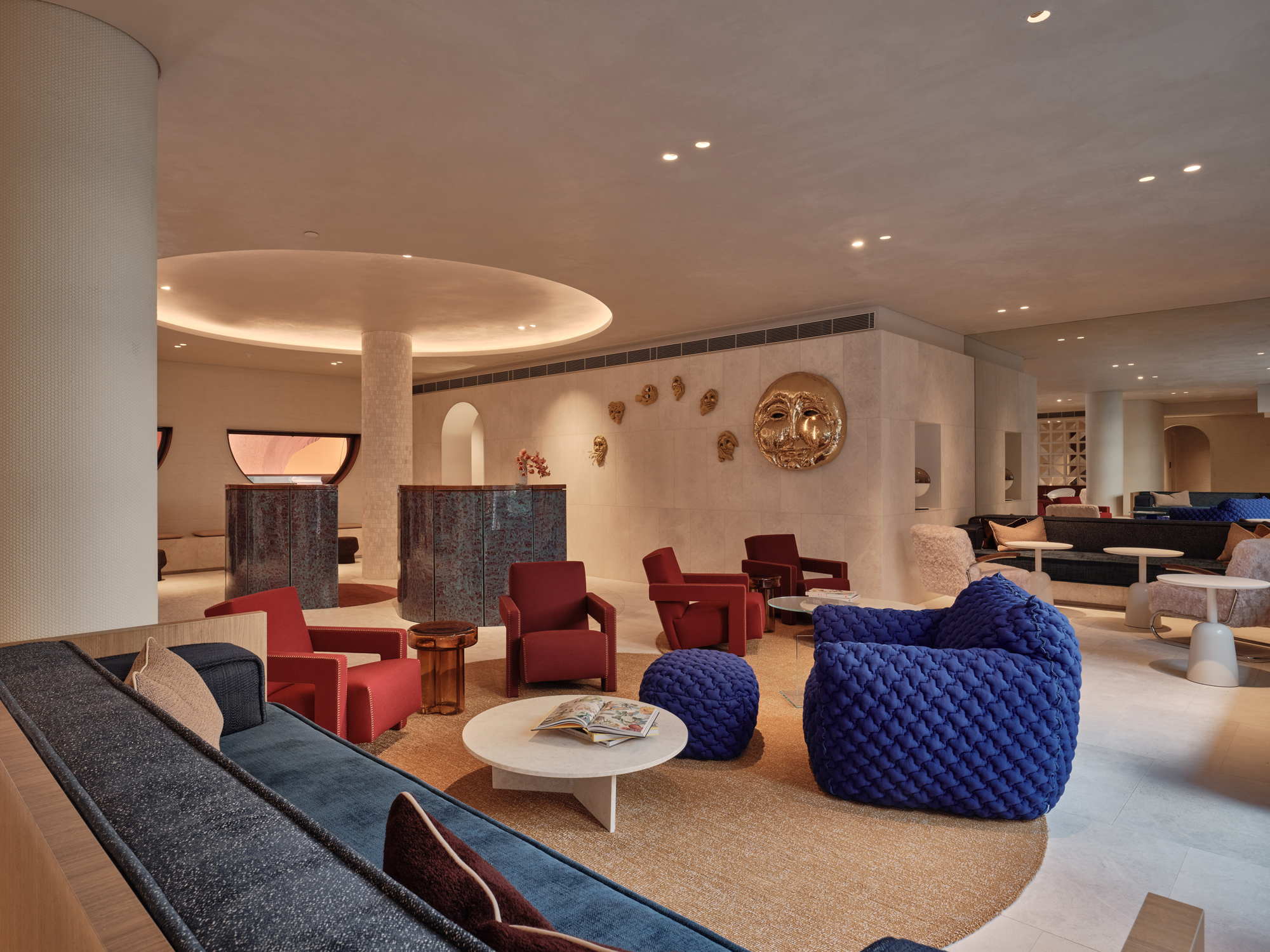 Stylish hotel lobby featuring colorful seating, modern decor, and unique wall art at The EVE Hotel Sydney.