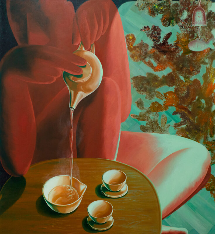 A figure pours tea from a teapot into a small cup, with a wooden table and abstract foliage in the background.