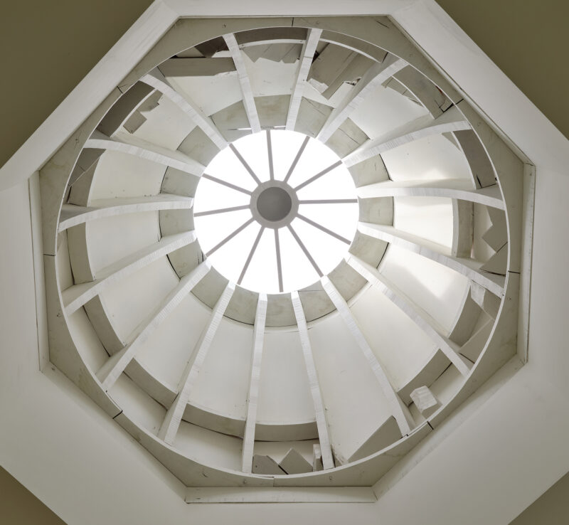 View of the octagonal skylight structure in Massarelos House, showcasing wooden beams and natural light.